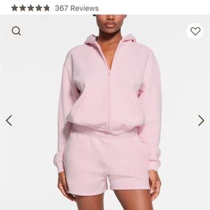 skims light pink zip up hoodie